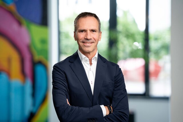 Justus Spehr smiling at the viewer