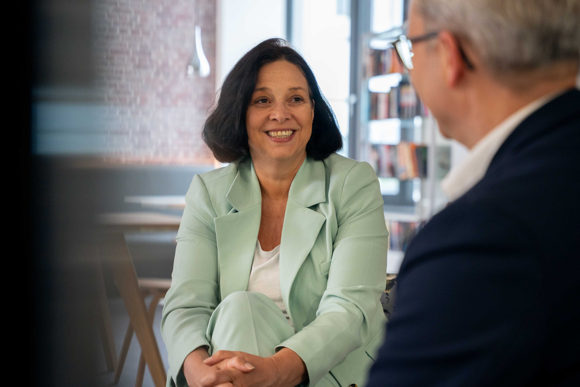 Sopra employee smiling at someone